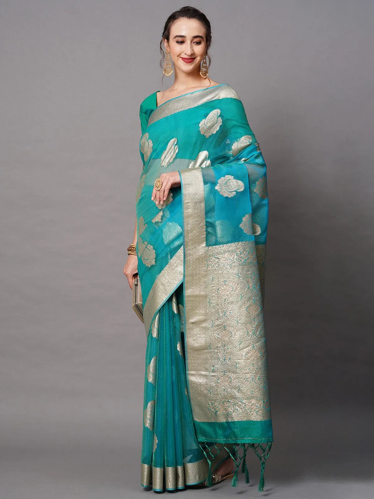 Odette Women Teal Blue Party Wear Organza Woven Design Saree With Unstitched Blouse