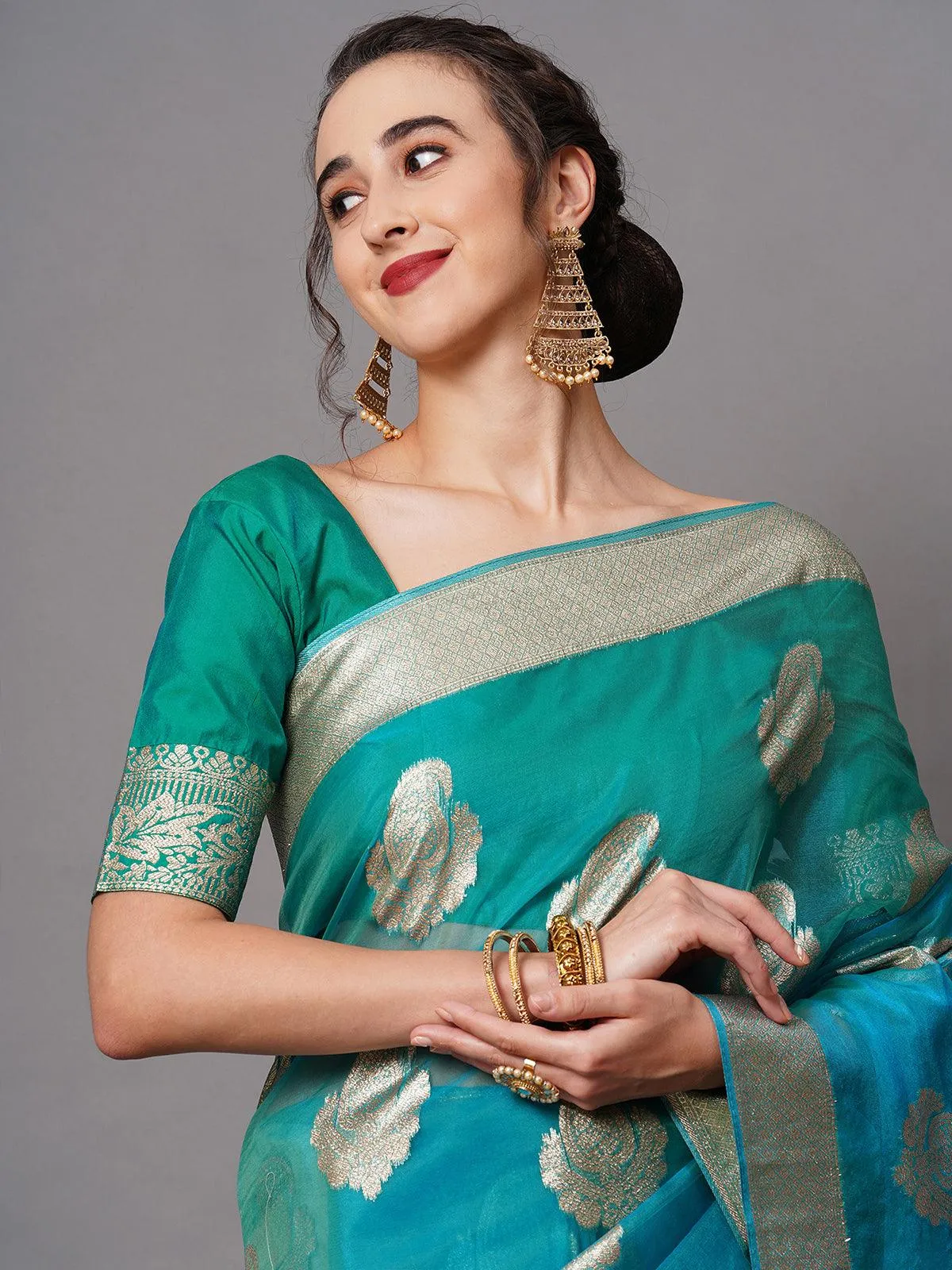 Odette Women Teal Blue Party Wear Organza Woven Design Saree With Unstitched Blouse